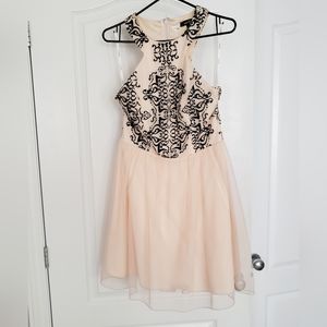 Sleeveless Fit and flare Peach Mini Party Dress with cut out black